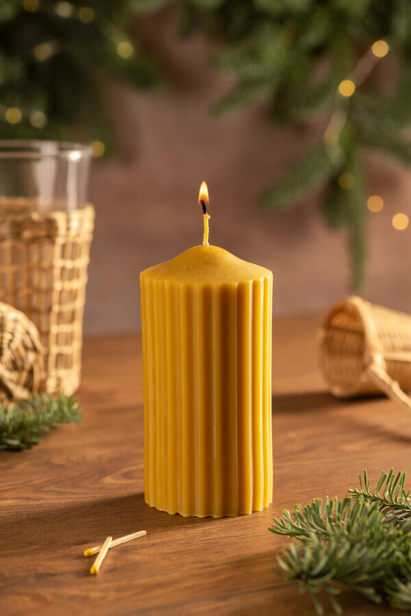 cylindrical beeswax candle